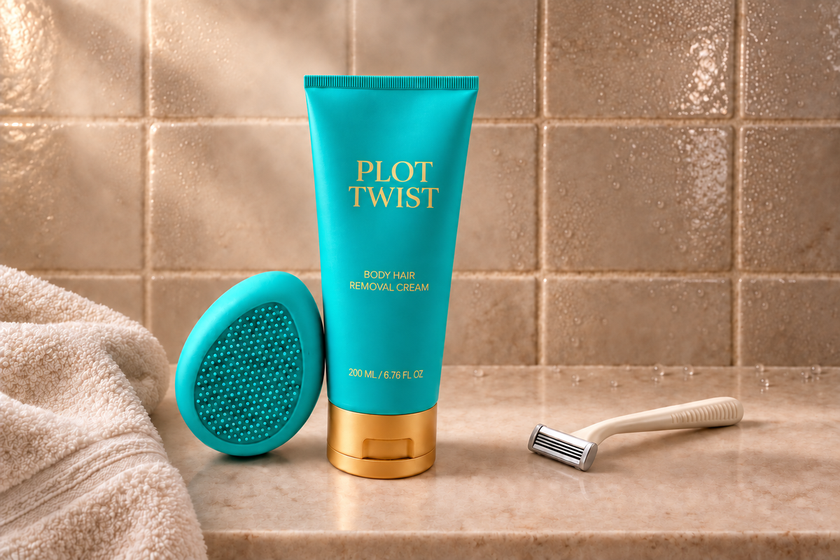 Plot Twist body hair removal cream and teal silicone Pebble beside an ivory razor and plush towel, with condensation on warm handmade bathroom tiles.